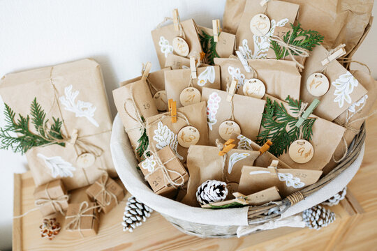Decorated paper bags prepared for advent calendar and kept in basket