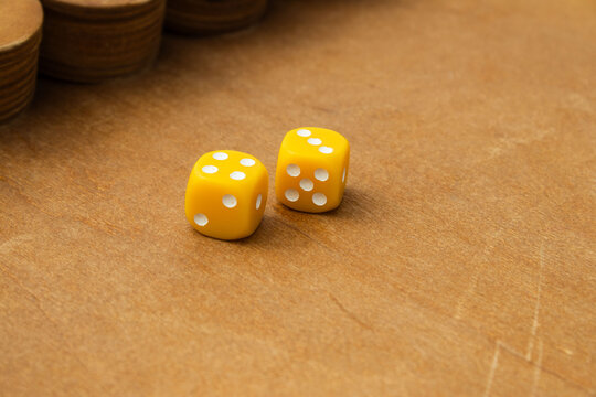 Yellow Dice Rolled on Wooden Shut the Box Board Game