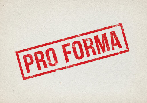 Red grunge rubber stamp with the text Pro Forma printed on a paper document
