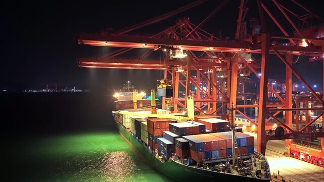 Unloading large cargo containers seaport. Loading freight sea port. Top aerial drone view. Lot big boxes rows, ship delivery ocean harbor. Shipping night. Goods export import. Industrial Marine dock.
