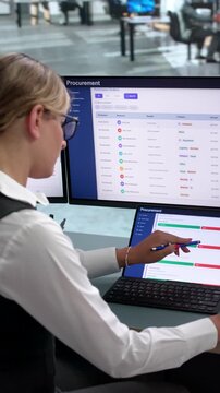 Procurement Manager Carefully Reviewing Supplier Contracts On Laptop