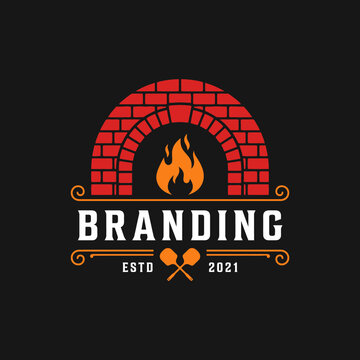 Brick oven pizza logo with fire and crossed peels.