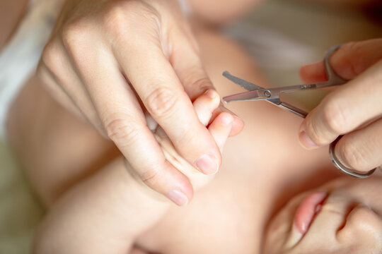 Close up view of newborn baby fingernail showing nail growth and skin health