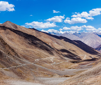 Himalayan valley scenery with road near Kunzum La pass - allegedly the highest motorable pass in the world (5602 m), Ladakh, India