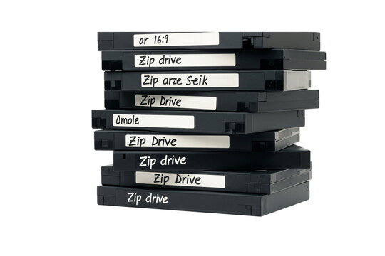 Stack of black Zip drive disks on white background
