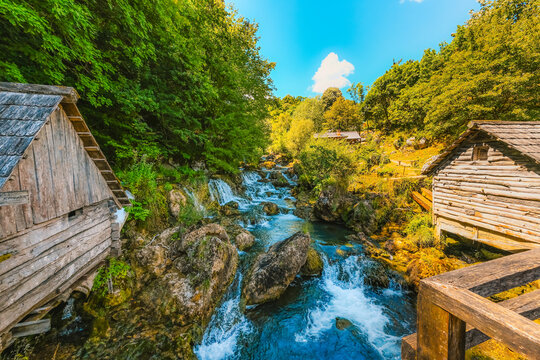 Traditional wooden watermills on the Krupa river waterfalls, a scenic rural landscape near Banja Luka, Bosnia and Herzegovina.