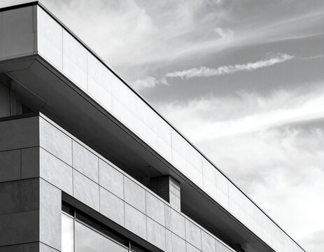 Modern building with a flat roof under cloudy sky