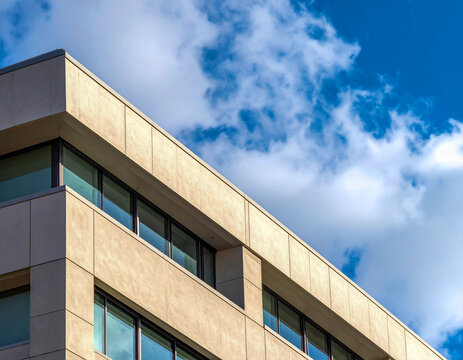 Building with large windows under a bright blue sky during daytime