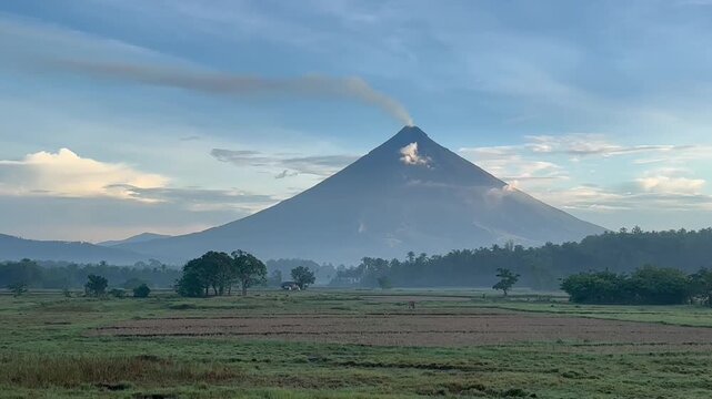 Majestic Mount Mayon volcano with perfect cone shape and rice fields in Albay Philippines 