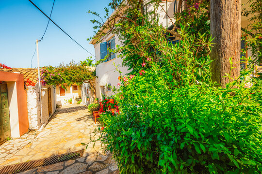 Alley decorated with flowers in the picturesque village of Afionas vacation on the island of Corfu in Greece nearPorto Timoni beach