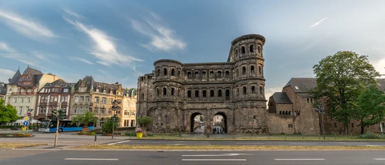 Panoramic View of the Porta Nigra in Trier, Germany Under Dramatic Evening Sky © tichr