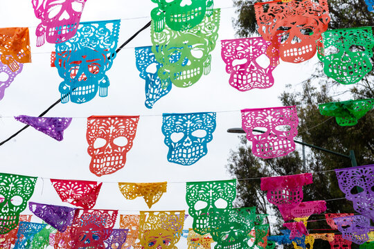 Colorful Sugar Skull Papel Picado Decorations Celebrating Day of the Dead in Mexico