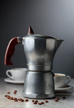 An authentic vintage Italian coffee maker with a retro design and aged metal texture.