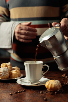 Profiteroles with mascarpone and cup of black coffee.