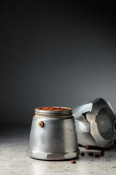 Coffee preparation in a classic Italian aluminium moka pot.
