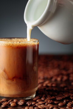 Cream is added to the coffee.