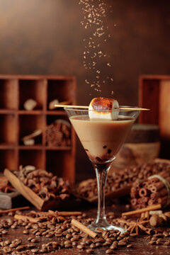 Cream and coffee cocktail with toasted marshmallow and chocolate crumbs.