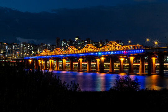 Illuminated bridge over Han River at night in Seoul, South Korea