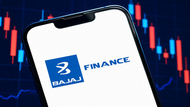 Illustrative editorial concept of the Bajaj Finance logo on a white-screen smartphone before falling candlesticks and a bearish market graph.