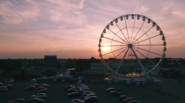 Coastal sunset seaside holiday resort of Skegness on the east coast of Lincolnshire UK, English vacation and sweeping vista views. Evening nightlife with Big Wheel rides and amusements. Pier and town