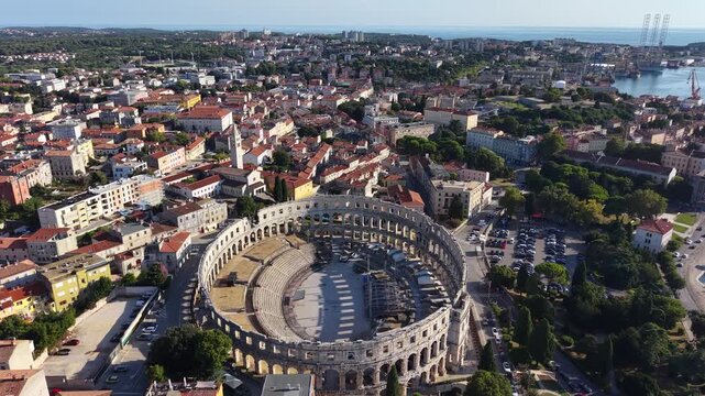 Flight over Pula Arena Roman amphitheater and Pula city center, Croatia