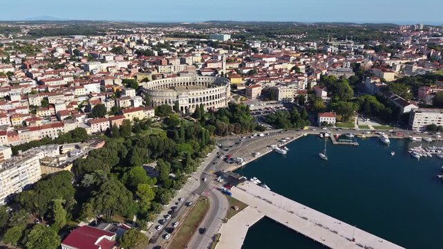 Drone shot of Pula cittyscape and coastal harbour in Pula, Croatia