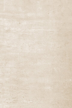 Full frame soft cream concrete wall background featuring pale cement textures with subtle grunge details and a mottled stone surface for minimalist interior design.