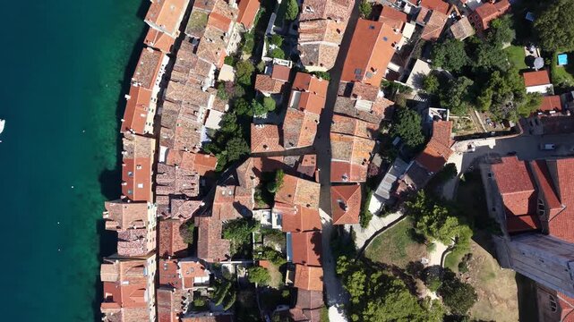 Top down view of old town red roofs and coast in Rovinj city, Croatia