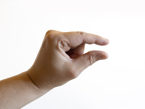 Human hand on a white background showing a small gap between thumb and index finger. The gesture means &ldquo;small,&rdquo; &ldquo;tiny,&rdquo; or &ldquo;a little bit.&rdquo;