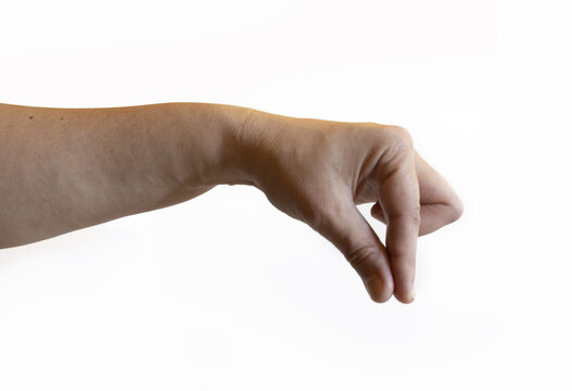 Human hand with fingers bent downward and thumb touching the index finger on a white background. The gesture shows pinching, precision, or holding a small object.