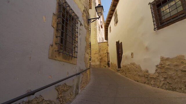 Narrow uphill alley beside the Episcopal Palace in the old town of Cuenca Spain