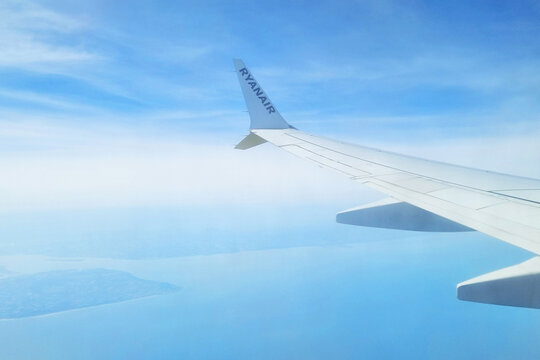 London, United Kingdom, July 10, 2026: Aerial View of Wing Over Blue Horizon for Travel and Aviation Enthusiasts