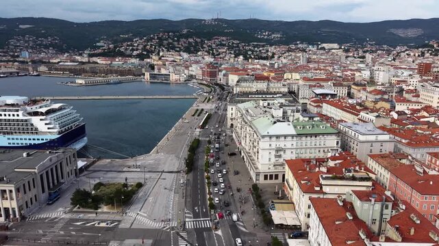 Flight over seaside waterfront promenade in Trieste, Italy