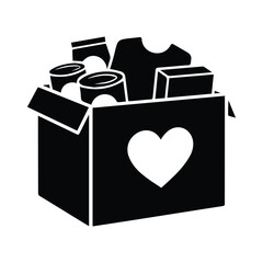 Fototapeta premium Donation box with heart symbol filled with canned food t-shirt and goods for charity.
