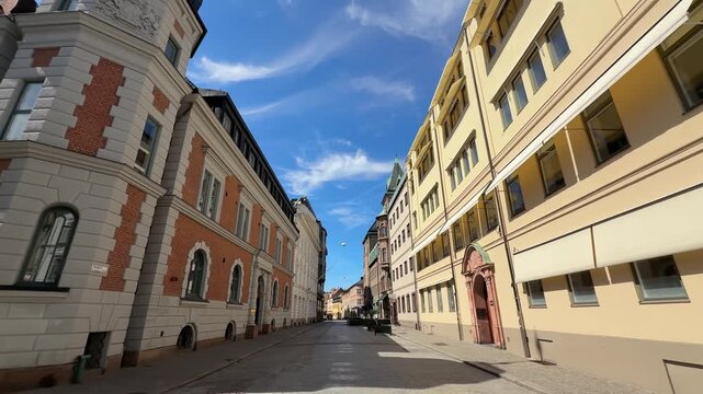 View down an empty historic street in old town center of Malmo city, Sweden