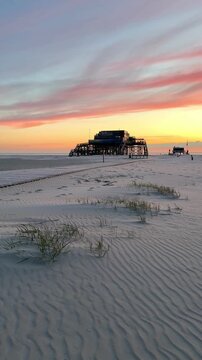 stilt house in sunset light at the beach