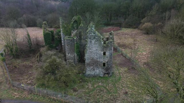 Drone crane shot reveals Old Auchans House ivy-clad ruins in Ayrshire, Scotland