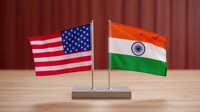 Usa and india flags waving together on desk for international diplomacy and business relations