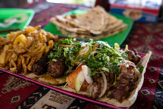 Traditional Armenian Khorovats Grilled Meat Kebabs with Herbs and Lavash