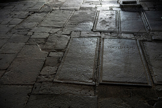 Ancient Inscribed Gravestones on Stone Floor inside Armenian Monastery