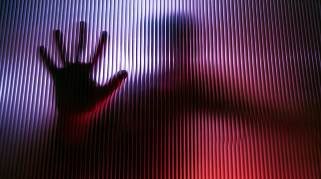 Hand Pressing Against Glass Barrier Abstract Concept