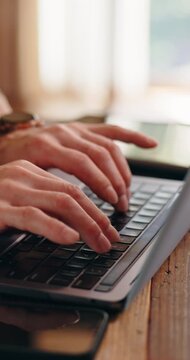 Man, hands and laptop in home for remote work, editing article or research tips for productivity. Writer, computer and typing with connectivity for publishing, fact checking and project forum