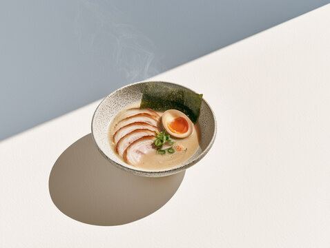 Japanese ramen with pork chashu egg and nori angled view sunlight