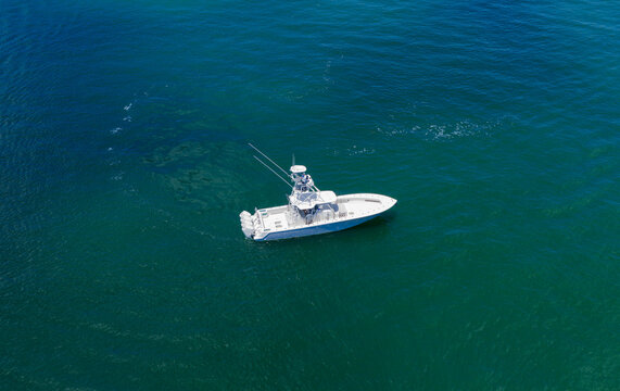 Luxury private yacht in sea. Motor yacht luxury vessel. Boat motor aerial. Vacation on summer season. Aerial view motorboat. Yacht boat tour. Luxury boat yachting. Motorboat sailing at sea