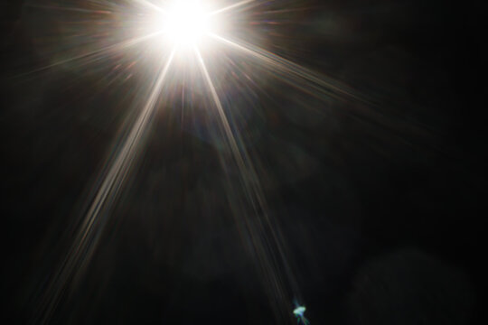 Real Lens Flare Optical Sunburst Effect Overlay on Black Background