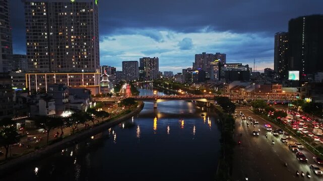 Night view of Vo Van Kiet Boulevard and canal in Ho Chi Minh City, Vietnam