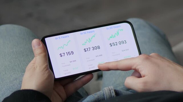 Smartphone displaying a long-term investment growth forecast. User reviews projected returns against initial capital for financial planning. 