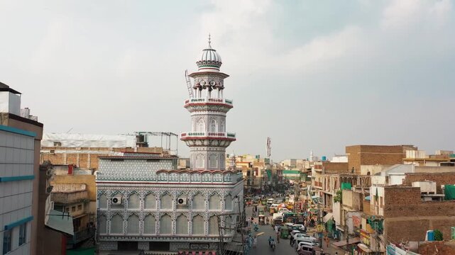 Top View of Urban Mosque at Street Intersection with Traffic and People