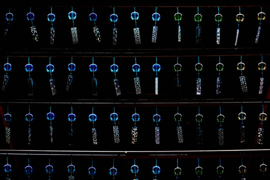 Rows of Blue and Green Japanese Wind Chimes Illuminated on a Summer Night.（風鈴）
