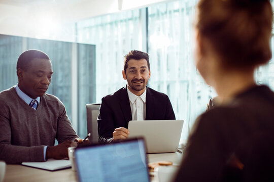 Business team discussing project in modern conference room